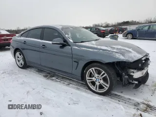 2016 BMW 4 Series 428i xDrive with VIN WBA4C9C59GG141121, listed as a Copart auction lot 45230225 with 103,576 mi miles and Salvage Title. Bid and sale history available at DreamBid. Image 4.