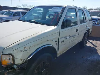 1997 Isuzu Rodeo z VIN 4S2CK58V2V4300048, wystawiony jako IAAI lot #41446738 z przebiegiem 195 609 mil mil oraz . Historia ofert i sprzedaży dostępna na DreamBid. Obrazek 6.