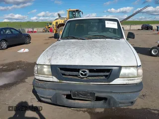 2002 Mazda B-Series 2WD Truck SX with VIN 4F4YR12D42TM18276, listed as a IAAI auction lot 41723184 with 142,623 mi miles. Bid and sale history available at carsss.com. Image 6.