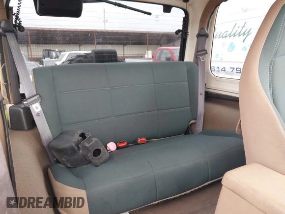 2002 Jeep Wrangler Sahara with VIN 1J4FA59S02P760345, listed as a IAAI auction lot 41634902 with 123,506 mi miles. Bid and sale history available at carsss.com. Image 8.