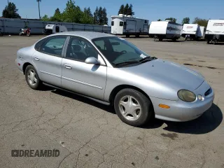 1999 Ford Taurus SE with VIN 1FAFP53U9XG171645, listed as a Copart auction lot 53187385 with 180,644 mi miles and Clean title. Bid and sale history available at DreamBid. Image 4.