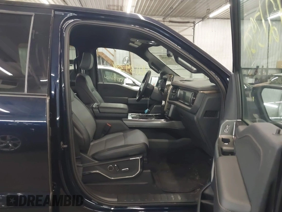 2023 Ford F-150 Lightning Pro with VIN 1FTVW1EL4PWG22900, listed as a IAAI auction lot 42139391 with 6,569 mi miles and . Bid and sale history available at DreamBid. Image 5.