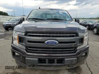 2019 Ford F-150 XL with VIN 1FTEW1EP4KFD32054, listed as a Copart auction lot 63622085 with 76,386 mi miles and Salvage title. Bid and sale history available at DreamBid. Image 5.