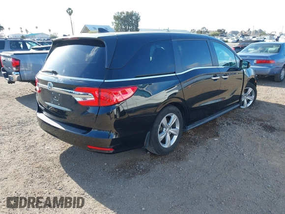 2019 Honda Odyssey EX with VIN 5FNRL6H54KB036540, listed as a IAAI auction lot 42124939 with 135,417 mi miles. Bid and sale history available at carsss.com. Image 4.
