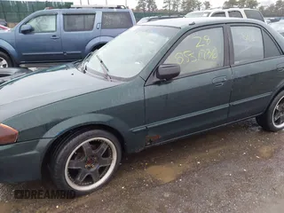 2000 Mazda Protege DX with VIN JM1BJ2225Y0255349, listed as a IAAI auction lot 41604895 with Not Provided miles and . Bid and sale history available at DreamBid. Image 6.
