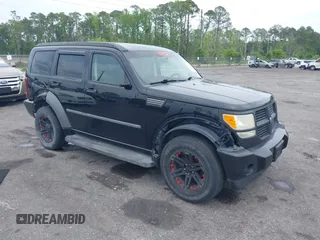 2007 Dodge Nitro SXT with VIN 1D8GT28K17W605984, listed as a IAAI auction lot 41970841 with 118,700 mi miles. Bid and sale history available at carsss.com. Image 1.