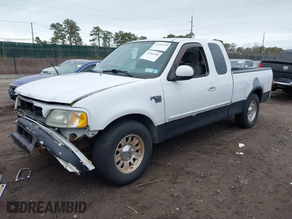 2003 Ford F-150 XL with VIN 1FTRX17W73NA42322, listed as a IAAI auction lot 41680100 with 129,295 mi miles. Bid and sale history available at carsss.com. Image 2.