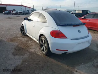 2012 Volkswagen Beetle 2.0T Turbo PZEV with VIN 3VW4A7AT6CM648540, listed as a IAAI auction lot 41326503 with 118,929 mi miles. Bid and sale history available at carsss.com. Image 3.