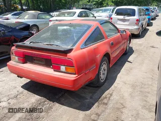 1986 Nissan 300ZX z VIN JN1HZ14S4GX164916, wystawiony jako IAAI lot #42295717 z przebiegiem 254 114 mil mil oraz . Historia ofert i sprzedaży dostępna na DreamBid. Obrazek 4.