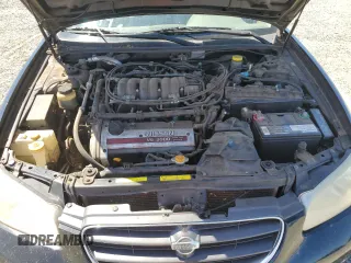 2000 Nissan Maxima GXE z VIN JN1CA31D6YT762114, wystawiony jako Copart lot #57908775 z przebiegiem 207 805 mil mil oraz Szkody całkowita. Historia ofert i sprzedaży dostępna na DreamBid. Obrazek 11.