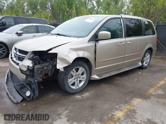 2013 Dodge Grand Caravan Crew with VIN 2C4RDGDG7DR624563, listed as a IAAI auction lot 42038157 with 265,044 mi miles and . Bid and sale history available at DreamBid. Image 2.