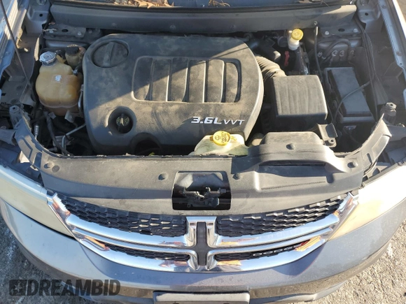 2013 Dodge Journey SXT with VIN 3C4PDCBG0DT522408, listed as a Copart auction lot 62699195 with 130,665 mi miles and Salvage title. Bid and sale history available at DreamBid. Image 12.