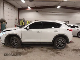 2018 Mazda CX-5 S Premium with VIN JM3KFBDM1J1412088, listed as a IAAI auction lot 41497431 with 65,532 mi miles and . Bid and sale history available at DreamBid. Image 14.