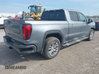 2021 GMC Sierra 1500 Denali z VIN 3GTU9FETXMG382438, wystawiony jako IAAI lot #41880365 z przebiegiem 54 651 mil mil oraz . Historia ofert i sprzedaży dostępna na DreamBid. Obrazek 4.
