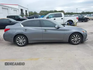 2015 Infiniti Q50 with VIN JN1BV7AP7FM357534, listed as a IAAI auction lot 41440900 with 101,982 mi miles. Bid and sale history available at carsss.com. Image 13.