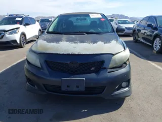2010 Toyota Corolla with VIN 1NXBU4EE2AZ299148, listed as a IAAI auction lot 41884899 with 303,174 mi miles. Bid and sale history available at carsss.com. Image 6.