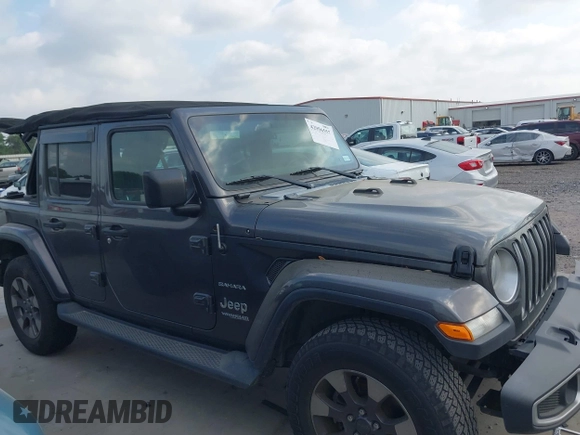 2018 Jeep Wrangler Unlimited Sahara z VIN 1C4HJXEG5JW194523, wystawiony jako IAAI lot #42056557 z przebiegiem 71 141 mil mil oraz . Historia ofert i sprzedaży dostępna na DreamBid. Obrazek 13.