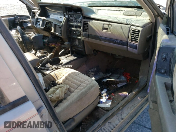 1994 Jeep Grand Cherokee Laredo z VIN 1J4GZ58S5RC328902, wystawiony jako Copart lot #70150474 z przebiegiem 195 604 mil mil oraz Szkoda całkowita • Salvage title. Historia ofert i sprzedaży dostępna na DreamBid. Obrazek 8.