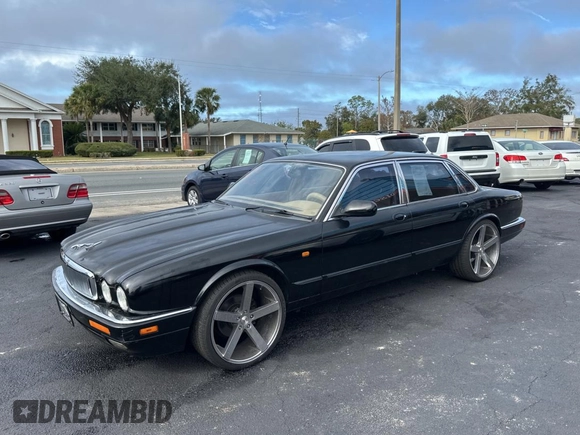 1995 Jaguar XJ with VIN SAJHX174XSC738291, listed as a Copart auction lot 87054224 with 71,076 mi miles and Clean title. Bid and sale history available at DreamBid. Image 2.