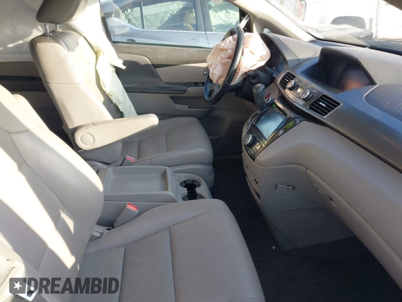 2014 Honda Odyssey Touring with VIN 5FNRL5H90EB077054, listed as a IAAI auction lot 41904456 with 197,869 mi miles and . Bid and sale history available at carsss.com. Image 5.