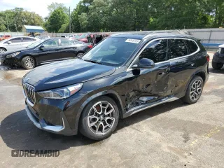 2025 BMW X1 xDrive28i with VIN WBX73EF02S5044732, listed as a Copart auction lot 56949705 with 15,863 mi miles and Salvage title. Bid and sale history available at DreamBid. Image 1.
