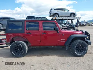 2012 Jeep Wrangler Unlimited Sport z VIN 1C4BJWDG8CL258625, wystawiony jako IAAI lot #42266102 z przebiegiem 58 594 mil mil oraz . Historia ofert i sprzedaży dostępna na DreamBid. Obrazek 14.