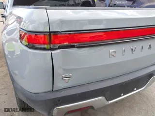 2023 Rivian R1T Adventure with VIN 7FCTGBAA9PN027894, listed as a IAAI auction lot 42061339 with 5,047 mi miles. Bid and sale history available at carsss.com. Image 22.
