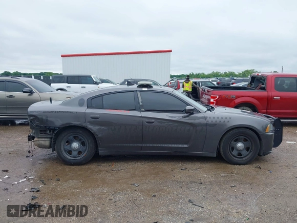 2013 Dodge Charger Police z VIN 2C3CDXAT4DH521778, wystawiony jako IAAI lot #42169438 z przebiegiem 191 907 mil mil oraz . Historia ofert i sprzedaży dostępna na DreamBid. Obrazek 13.