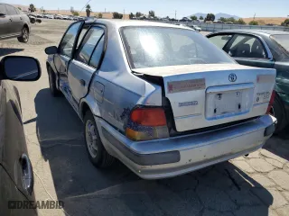 1995 Toyota Tercel DX with VIN JT2EL56E7S7011335, listed as a Copart auction lot 67978774 with 182,025 mi miles and Salvage Title. Bid and sale history available at carsss.com. Image 2.