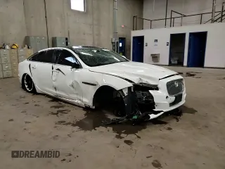 2014 Jaguar XJ Portfolio with VIN SAJWJ2GD2E8V69597, listed as a Copart auction lot 57798145 with 100,857 mi miles and Salvage title. Bid and sale history available at DreamBid. Image 14.