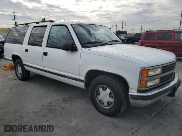 1996 Chevrolet Suburban with VIN 3GNEC16R5TG149147, listed as a Copart auction lot 84827204 with 320,305 mi miles and Salvage title. Bid and sale history available at DreamBid. Image 4.