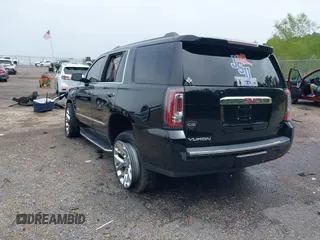 2016 GMC Yukon Denali with VIN 1GKS1CKJXGR254306, listed as a IAAI auction lot 39953539 with 164,149 mi miles. Bid and sale history available at carsss.com. Image 3.