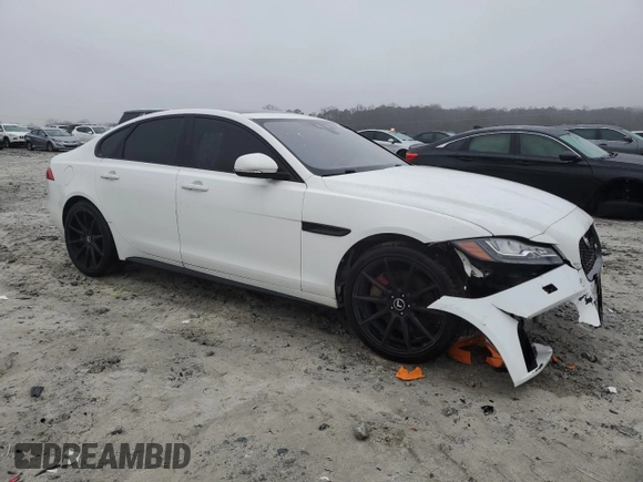 2016 Jaguar XF S with VIN SAJBG4BV6GCY17651, listed as a Copart auction lot 82511083 with 117,677 mi miles. Bid and sale history available at carsss.com. Image 4.