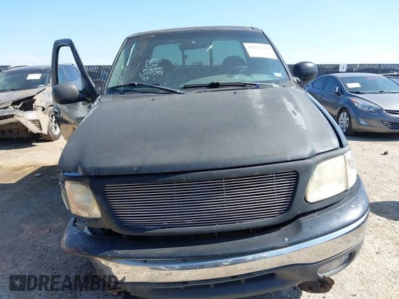 1999 Ford F-150 XL with VIN 1FTRX18L3XKA77743, listed as a IAAI auction lot 42512532 with Not provided miles and . Bid and sale history available at DreamBid. Image 13.