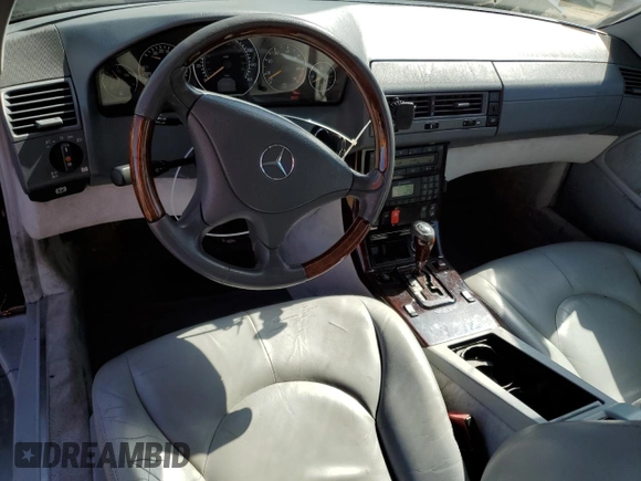 1999 Mercedes-Benz SL-Class with VIN WDBFA68F8XF186072, listed as a Copart auction lot 69557094 with 99,691 mi miles and Salvage Title. Bid and sale history available at carsss.com. Image 8.