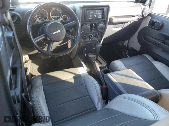 2007 Jeep Wrangler Unlimited Sahara with VIN 1J4GB59197L144781, listed as a Copart auction lot 48678315 with 137,538 mi miles and Salvage title. Bid and sale history available at DreamBid. Image 8.