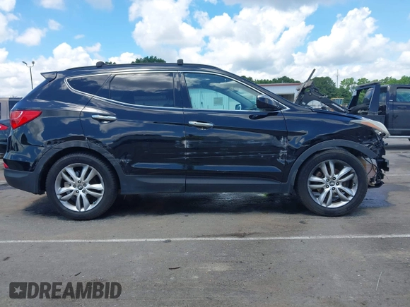 2013 Hyundai Santa Fe Sport z VIN 5XYZUDLA1DG050879, wystawiony jako IAAI lot #42236937 z przebiegiem 124 779 mil mil oraz . Historia ofert i sprzedaży dostępna na DreamBid. Obrazek 13.
