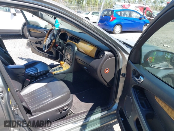 2004 Jaguar X-Type with VIN SAJEA51C04WD73023, listed as a IAAI auction lot 41874488 with 199,333 mi miles and . Bid and sale history available at DreamBid. Image 5.