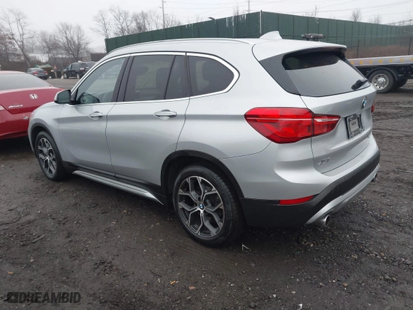2021 BMW X1 xDrive28i with VIN WBXJG9C04M5T79810, listed as a IAAI auction lot 41471536 with 75,345 mi miles. Bid and sale history available at carsss.com. Image 3.