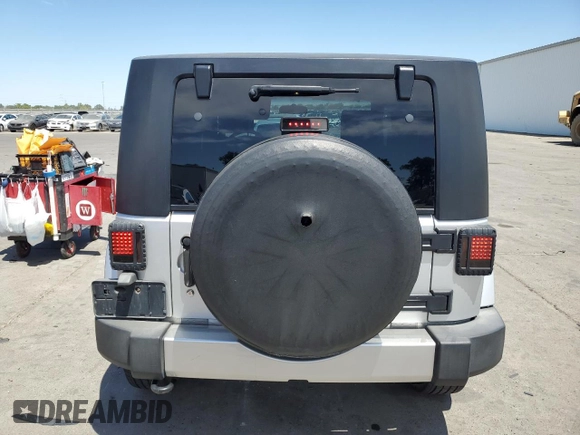 2009 Jeep Wrangler Sahara with VIN 1J4FA54149L708183, listed as a Copart auction lot 65989125 with 133,436 mi miles and Salvage title. Bid and sale history available at DreamBid. Image 6.