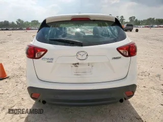 2016 Mazda CX-5 Sport with VIN JM3KE4BY0G0742436, listed as a Copart auction lot 59693945 with 74,314 mi miles and Salvage title. Bid and sale history available at DreamBid. Image 6.