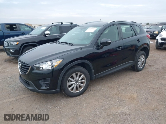 2016 Mazda CX-5 Sport with VIN JM3KE2BY4G0761933, listed as a IAAI auction lot 41709274 with 131,127 mi miles. Bid and sale history available at carsss.com. Image 18.