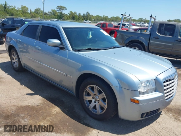 2006 Chrysler 300 Touring with VIN 2C3KA53G56H324954, listed as a IAAI auction lot 42058478 with 124,933 mi miles. Bid and sale history available at carsss.com. Image 1.