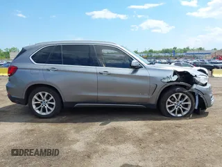2014 BMW X5 xDrive35i z VIN 5UXKR0C5XE0K43570, wystawiony jako IAAI lot #42211578 z przebiegiem 260 817 mil mil oraz . Historia ofert i sprzedaży dostępna na DreamBid. Obrazek 13.
