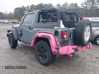 2015 Jeep Wrangler Sport with VIN 1C4AJWAG3FL589214, listed as a IAAI auction lot 41056259 with 101,758 mi miles and . Bid and sale history available at DreamBid. Image 3.