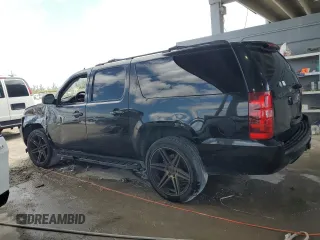2013 Chevrolet Suburban LT with VIN 1GNSCJE00DR300449, listed as a Copart auction lot 55134455 with 301,552 mi miles and Salvage title. Bid and sale history available at DreamBid. Image 2.