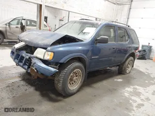 2003 Isuzu Rodeo with VIN 4S2CK58W634308515, listed as a IAAI auction lot 41843174 with 158,748 mi miles. Bid and sale history available at carsss.com. Image 2.