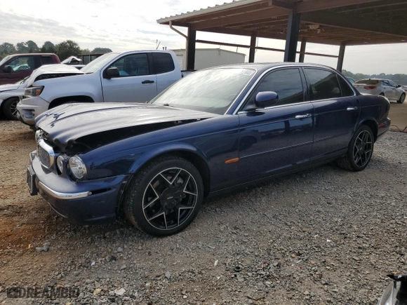 2004 Jaguar XJ with VIN SAJWA71C34SG19800, listed as a Copart auction lot 71877194 with 157,051 mi miles and Salvage Title. Bid and sale history available at carsss.com. Image 1.