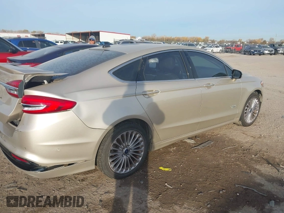 2017 Ford Fusion Titanium z VIN 3FA6P0SU5HR373140, wystawiony jako IAAI lot #41082406 z przebiegiem 98 422 mil mil oraz . Historia ofert i sprzedaży dostępna na DreamBid. Obrazek 4.