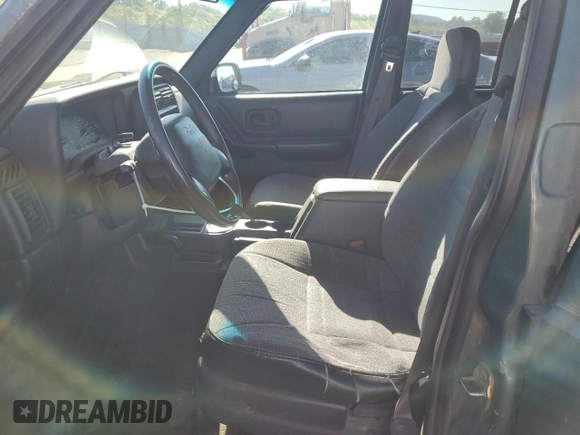 2000 Jeep Cherokee with VIN 1J4FF48S0YL198802, listed as a Copart auction lot 59996915 with 249,756 mi miles and Salvage title. Bid and sale history available at DreamBid. Image 7.